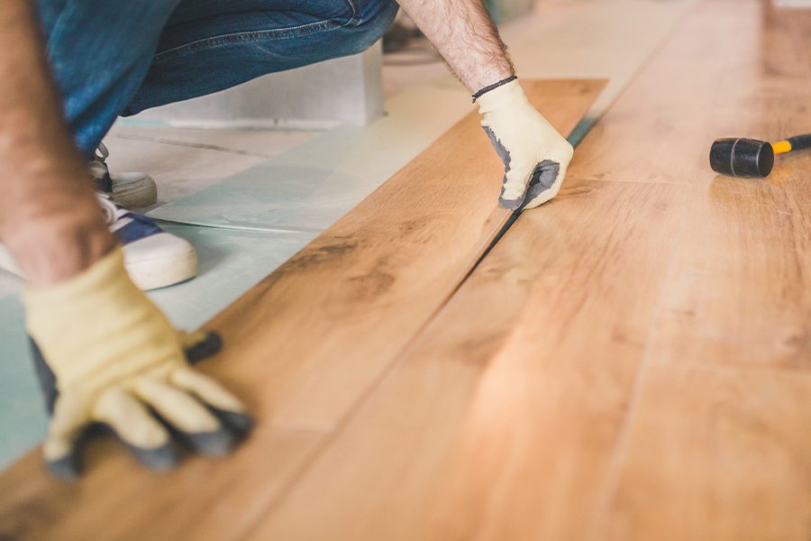 Flooring Contractor Insurance - Closeup of a Professional Flooring Installation by a Flooring Contractor
